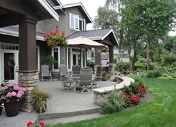 The main terrace seat wall provides room for serving trays, while adding addition informal seating for party guests.