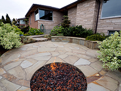 The built in seating faces the view and doubles as a retaining wall.