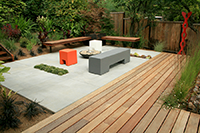 Flexible seating as well as built in ipe and steel benches provide entertaining spaces for the owners. The rear yard is lit at night to provide ambiance.